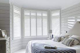 White wooden shutter blinds